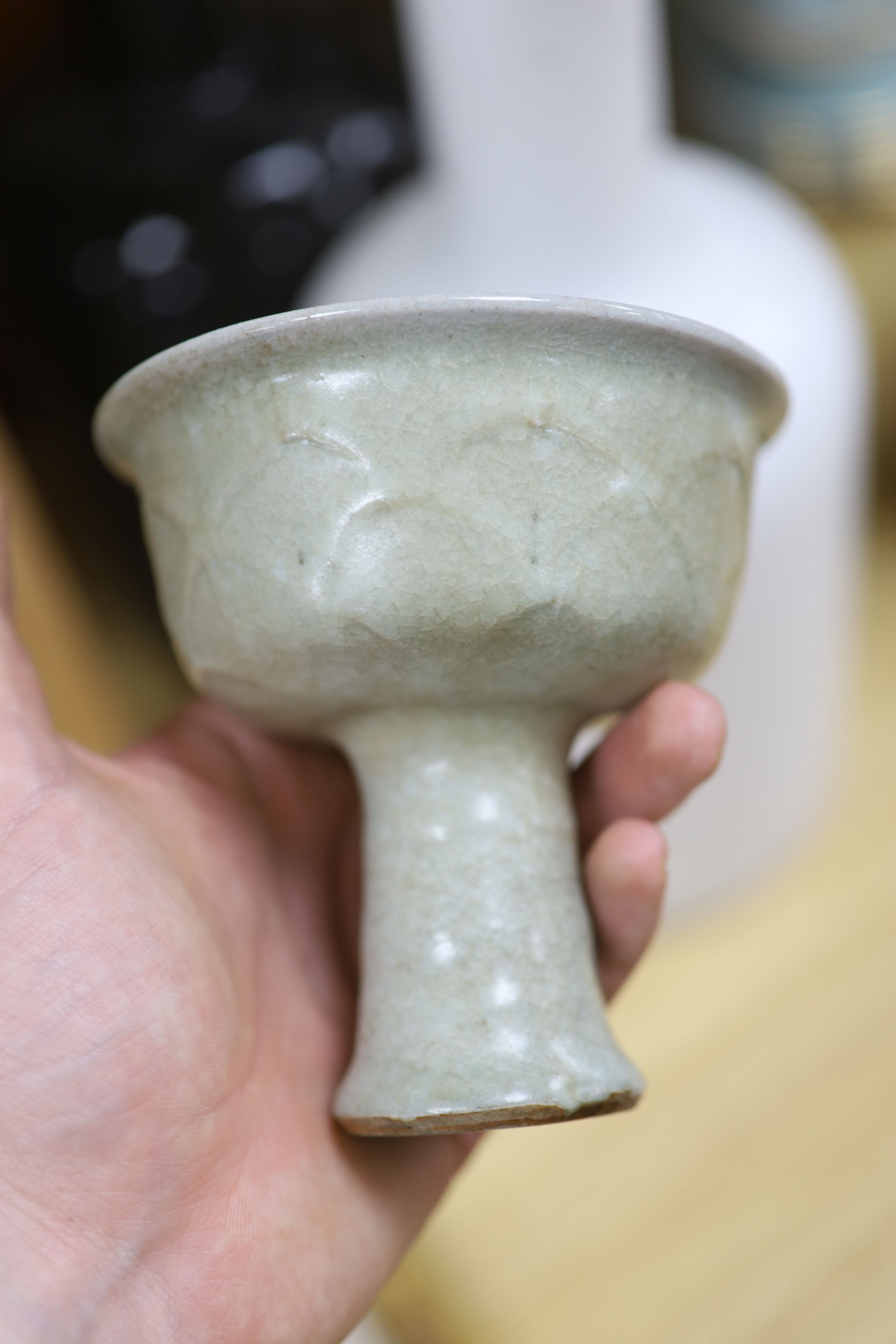 A Chinese blue and white bowl, diameter 15cm, a tea bowl and saucer, a crackleglaze shell dish and a celadon glazed stem cup